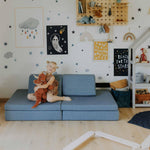 Universelles Kindersofa von monboxy in Türkis - Kletterling – einfach Kind sein